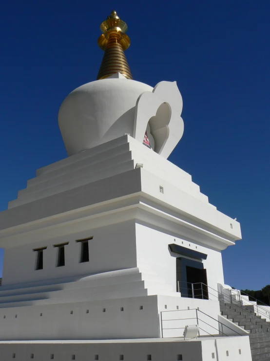 a large monument sitting under a blue sky