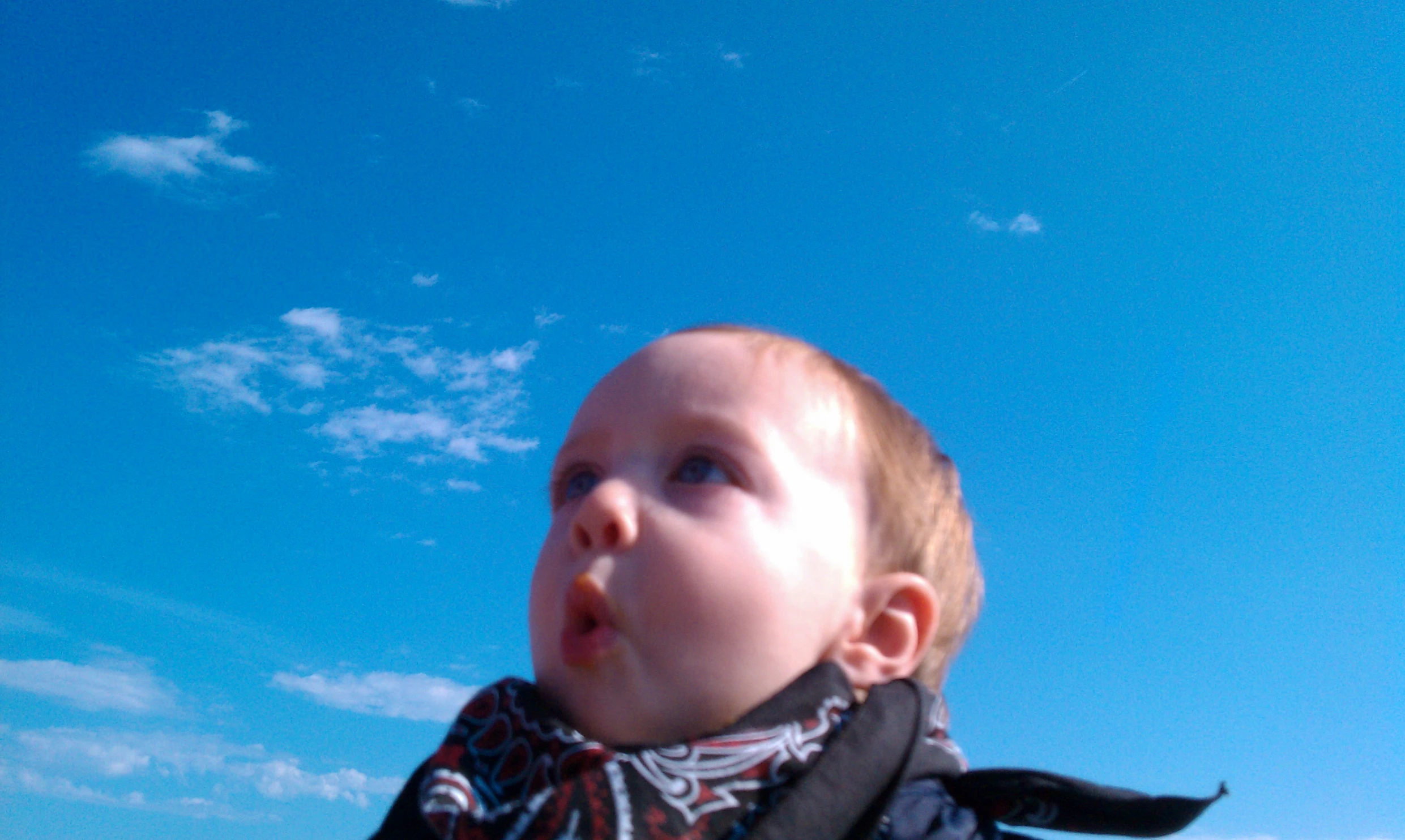 a boy is wearing a tie around his neck