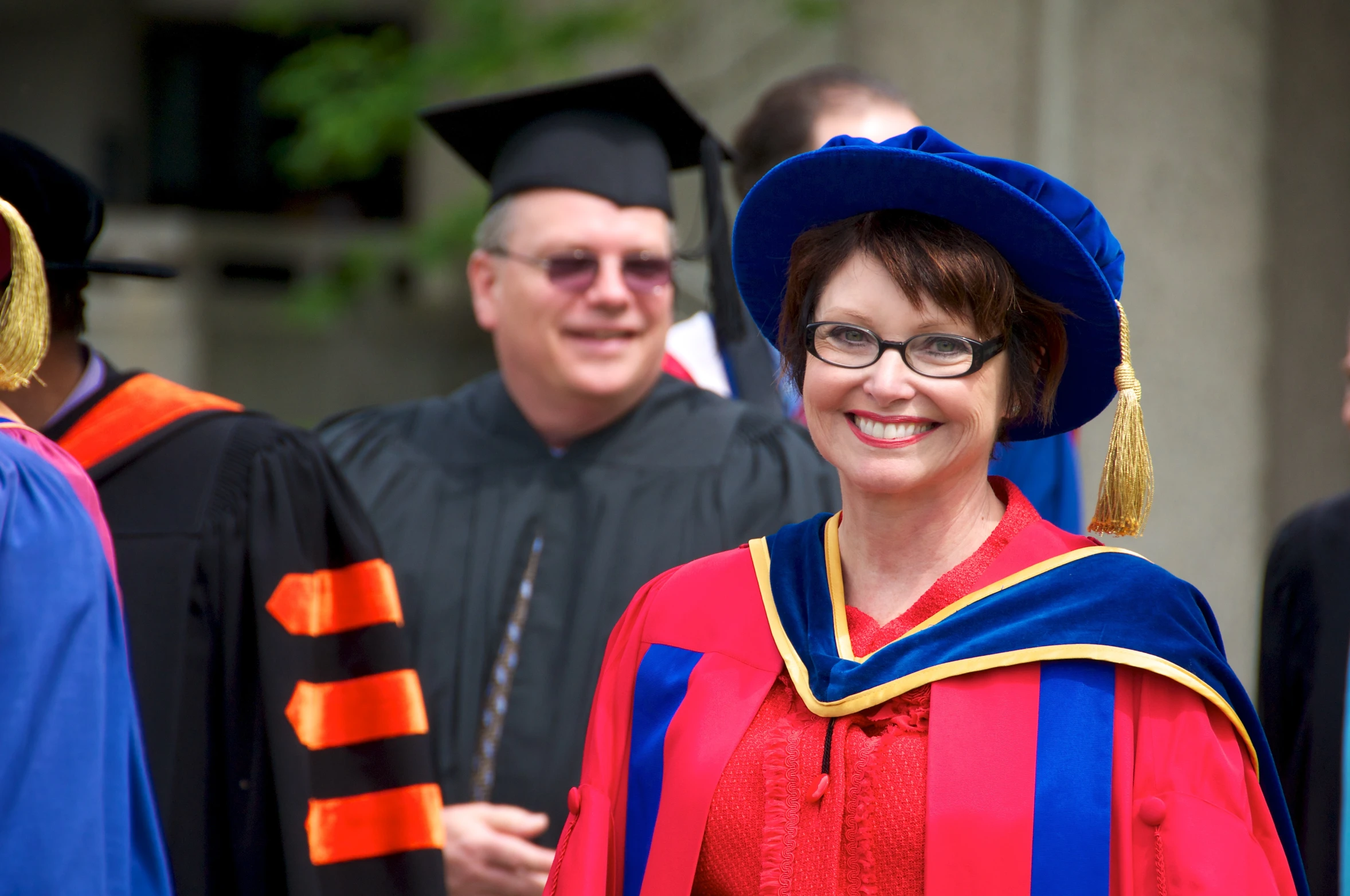 a woman in a graduation outfit and cap