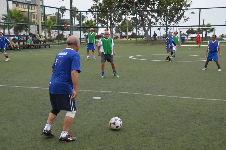 a group of people on a field playing soccer