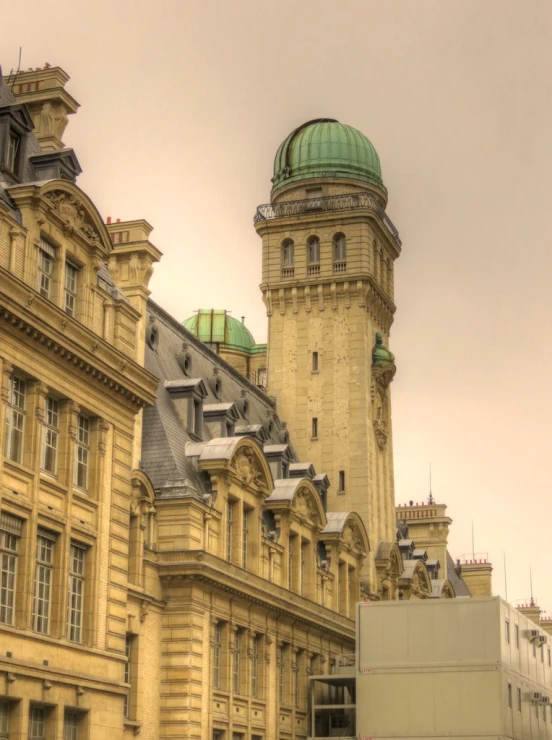 large buildings and a clock tower in the center of a town