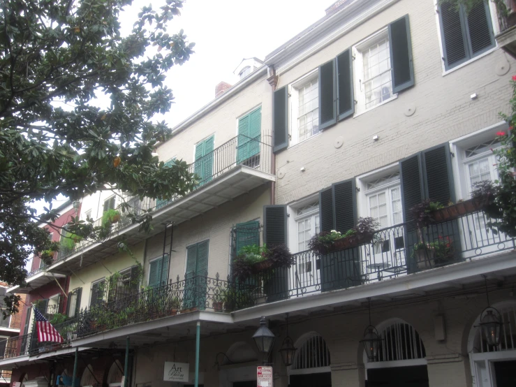 green shuttered balconies and green shuttered windows on buildings