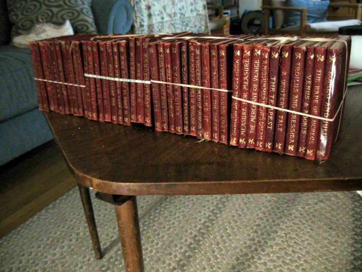 the books on the table are all stacked up