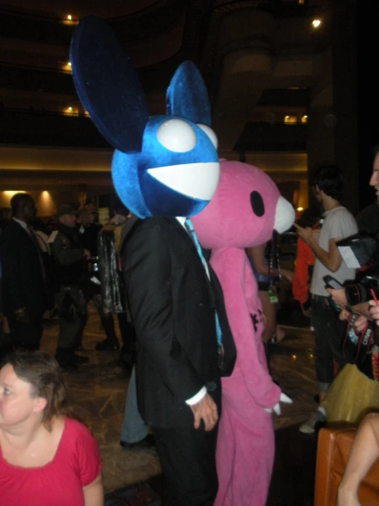 the man is in a pink bunny costume