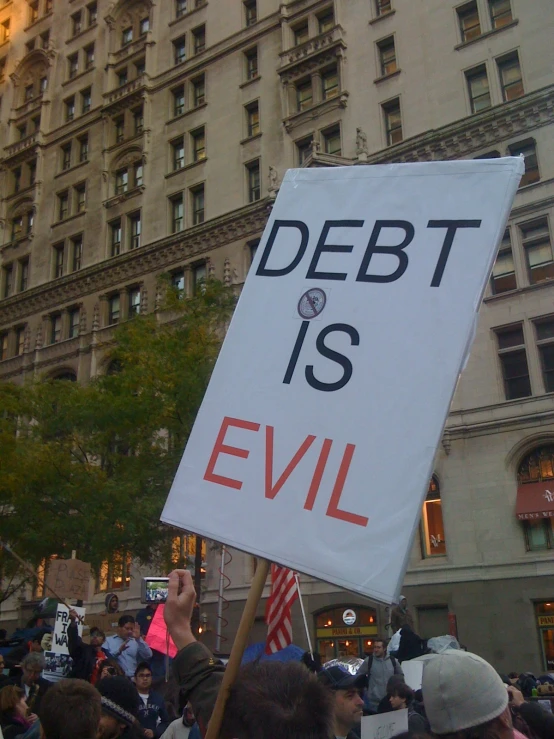 a protest with an anti - government sign