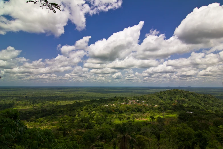 there are many clouds above the jungle