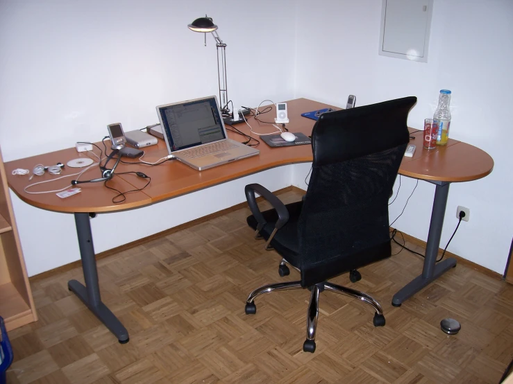 a table topped with a laptop computer and desktop monitor