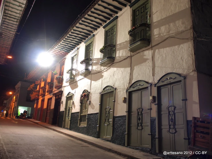 a night s of an alley with a street light