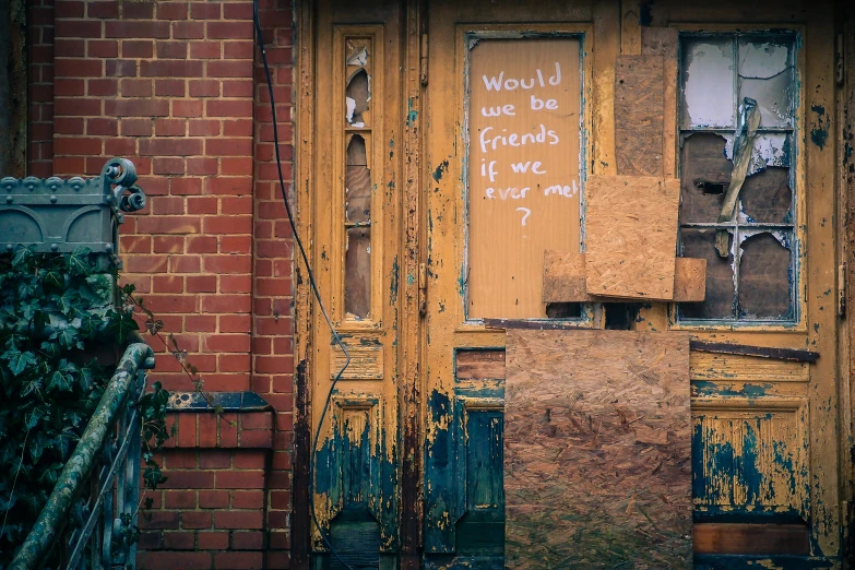 an old door with writing on it and a fire hydrant