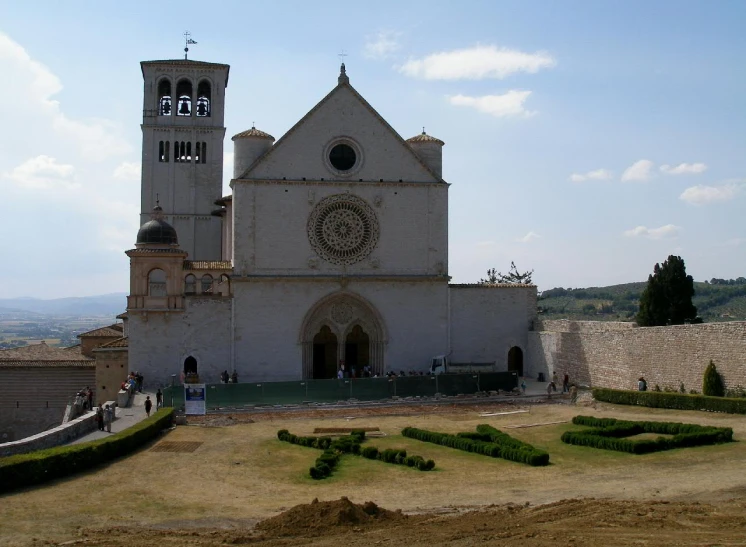 the white church has many steps leading to it