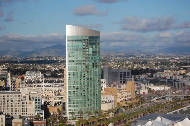 a building next to a freeway surrounded by tall buildings