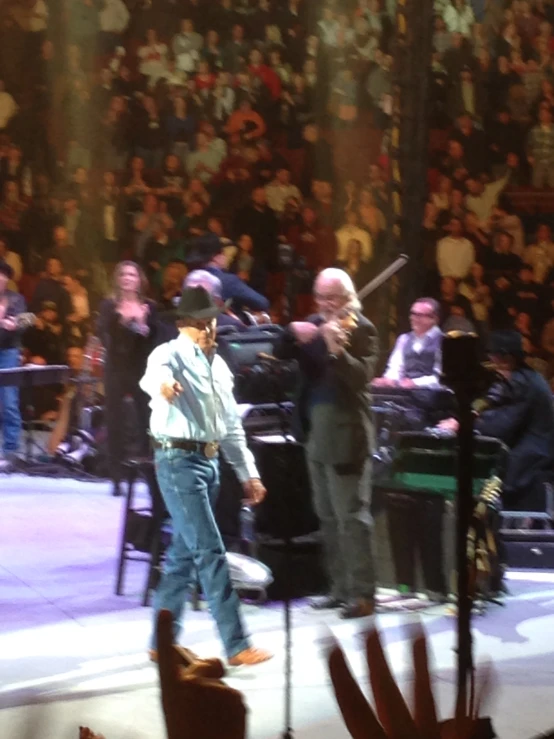 a group of people standing on top of a stage