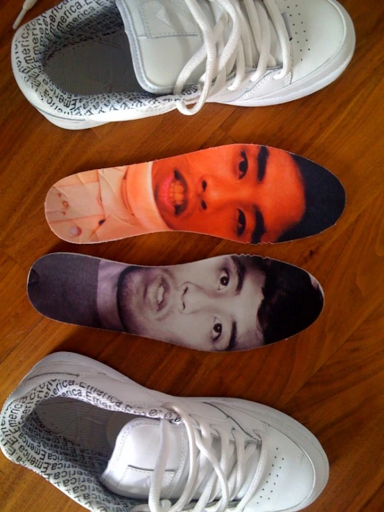 three shoes decorated with a portrait of a man