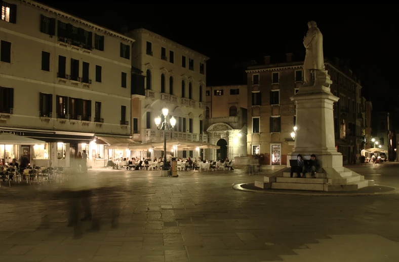 a crowd of people standing around a plaza