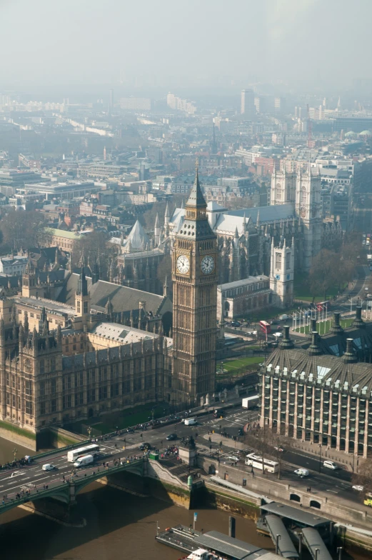 a big clock tower next to an over head cityscape