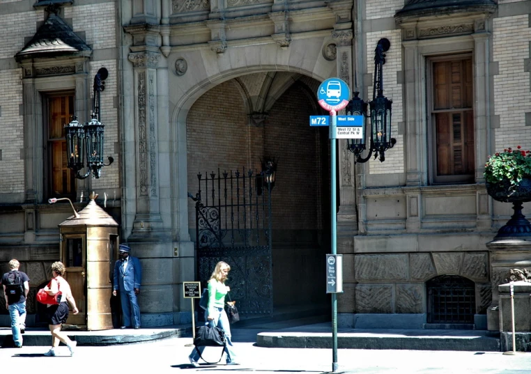 a person is walking by a building on a street
