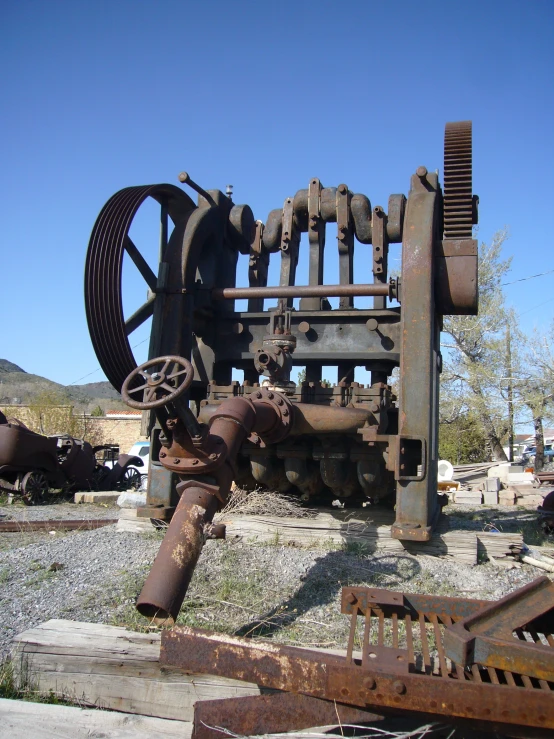 an image of old rusty equipment in the middle of nowhere