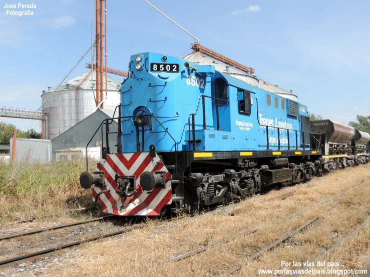 an electric train is pulled into the railroad tracks