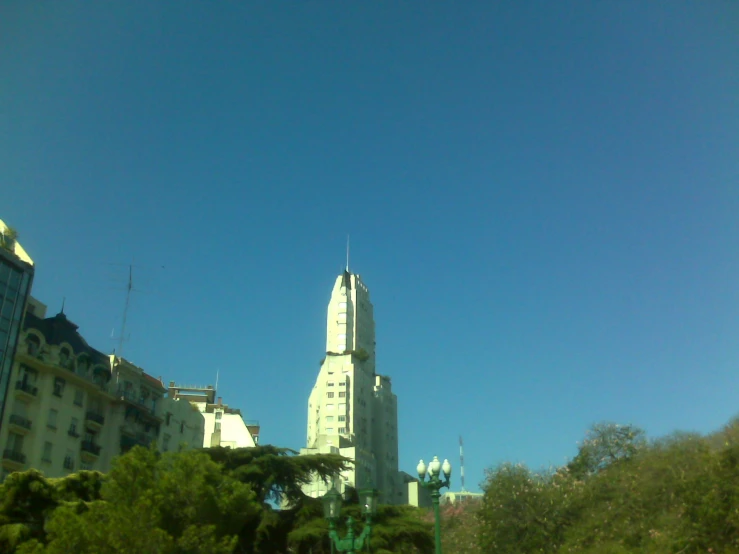 an image of the top of a building with a spire