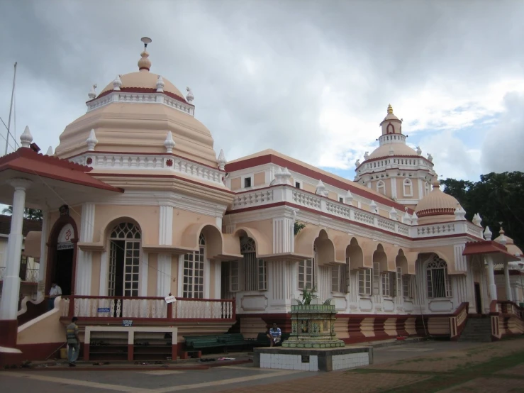 a big house with several windows and a balcony