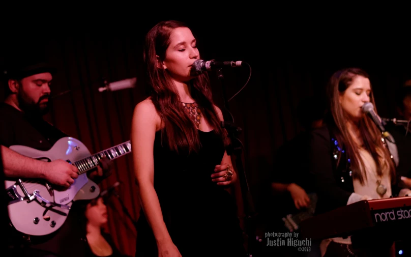 two people playing music on stage at the same time