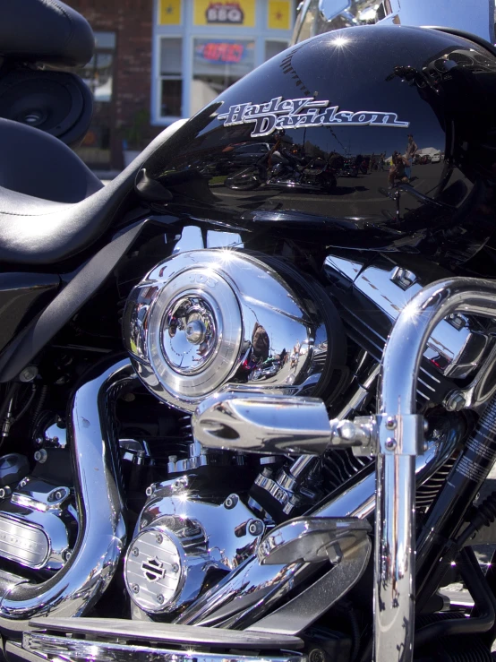 the close up view of a motorcycle parked in front of a store