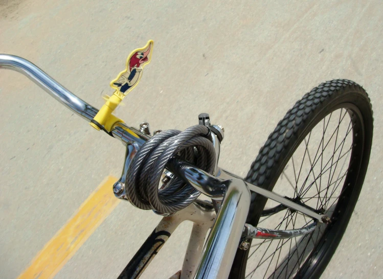 closeup of bicycle chain with front wheel in motion