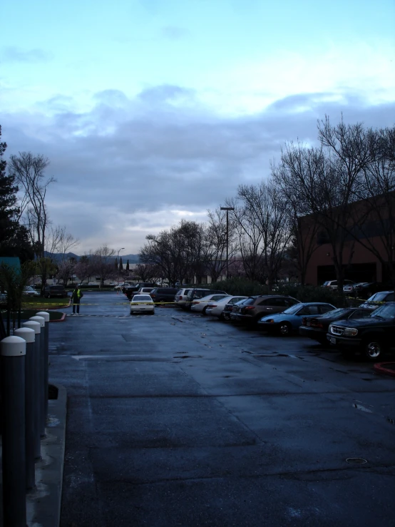 this is a city street lined with parked cars