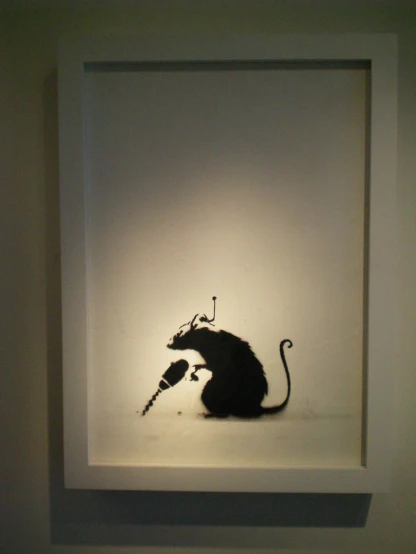 an animal mounted in a white frame in a museum