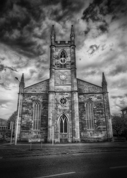 an old church with a clock in the middle