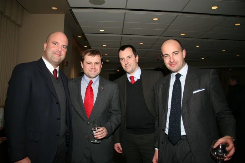 a group of men in suits standing together