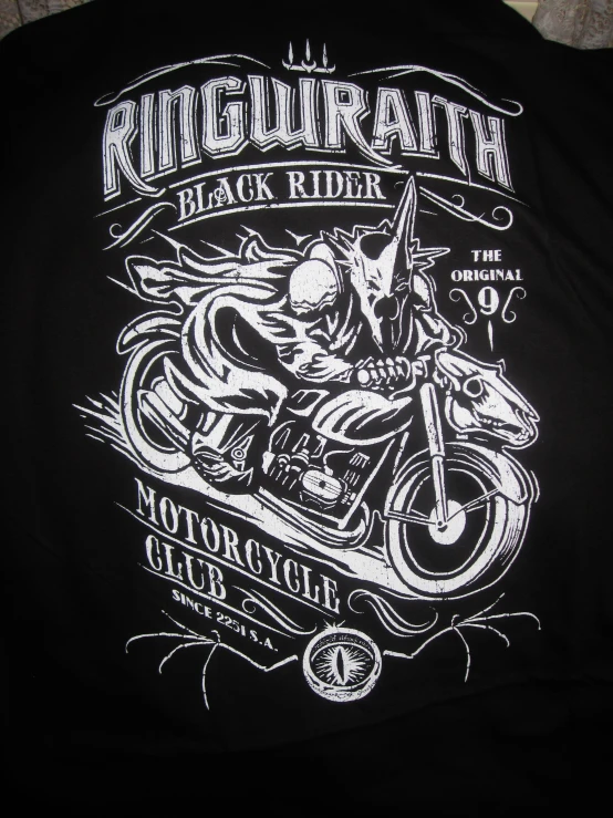 a black shirt with a biker on a motorcycle