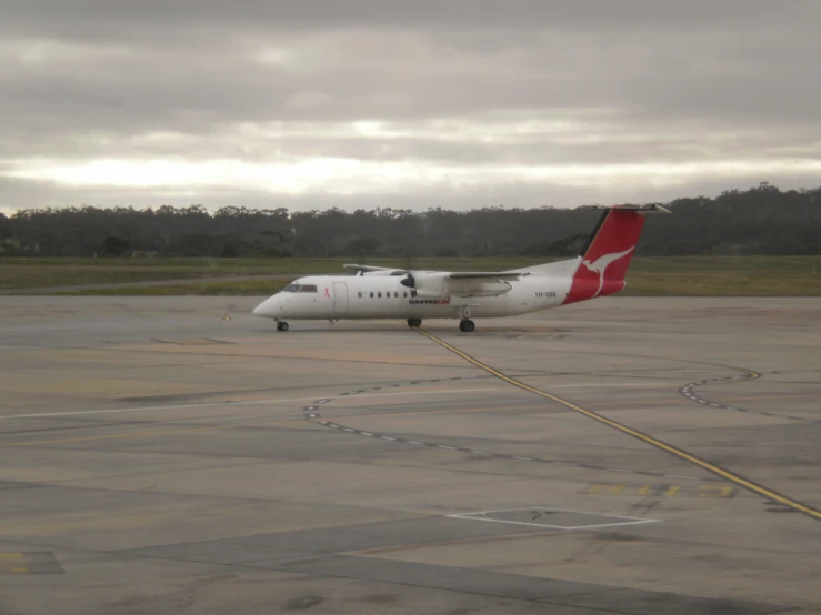 an air plane is at the airport, sitting on the runway