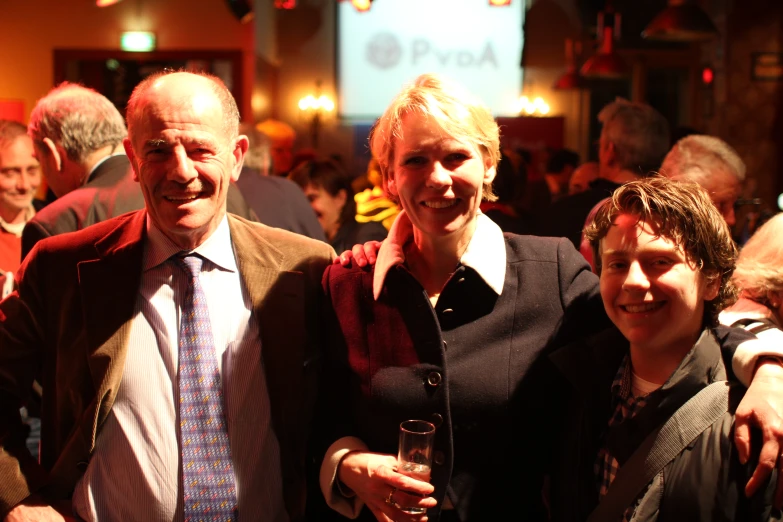 two men and two women pose for a po together