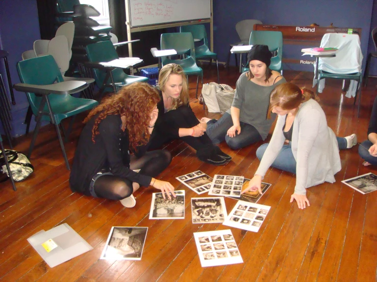 a group of girls are playing with a picture