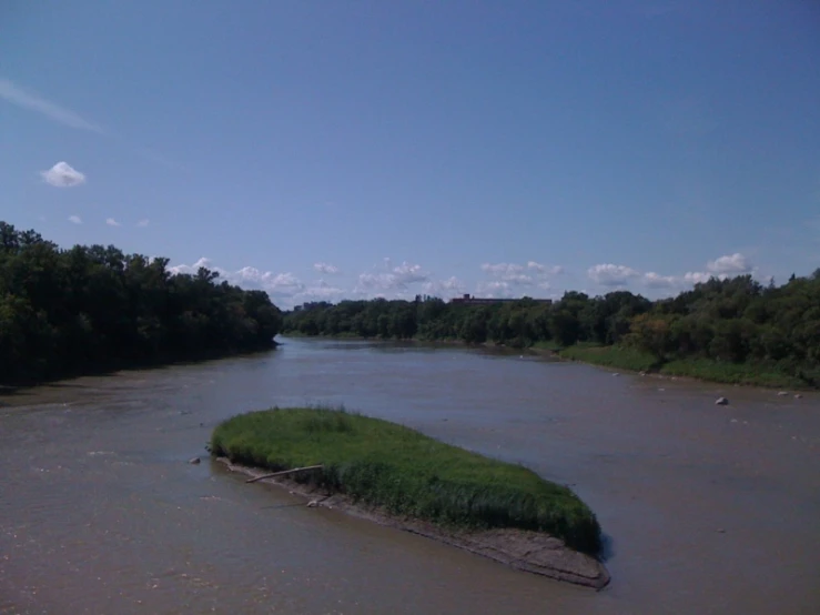 the green vegetation is growing on a very small island