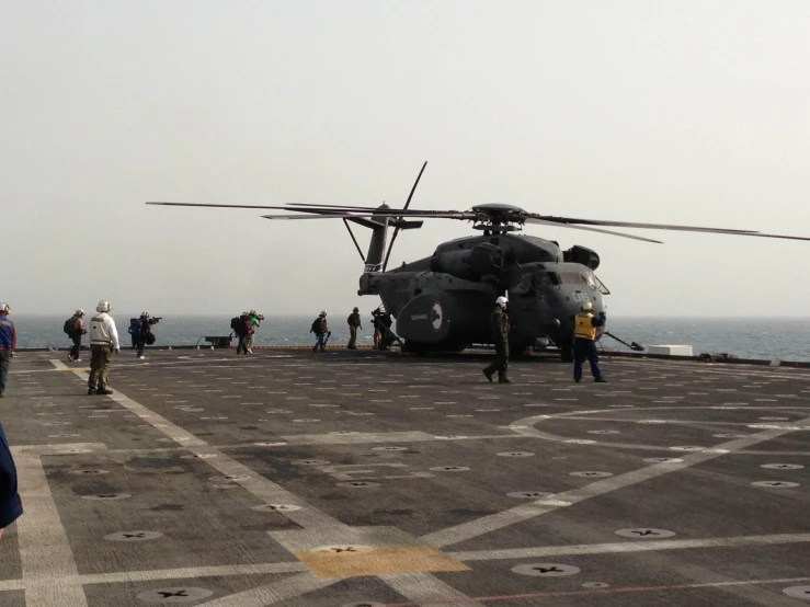 two army planes on the flight deck of an aircraft carrier