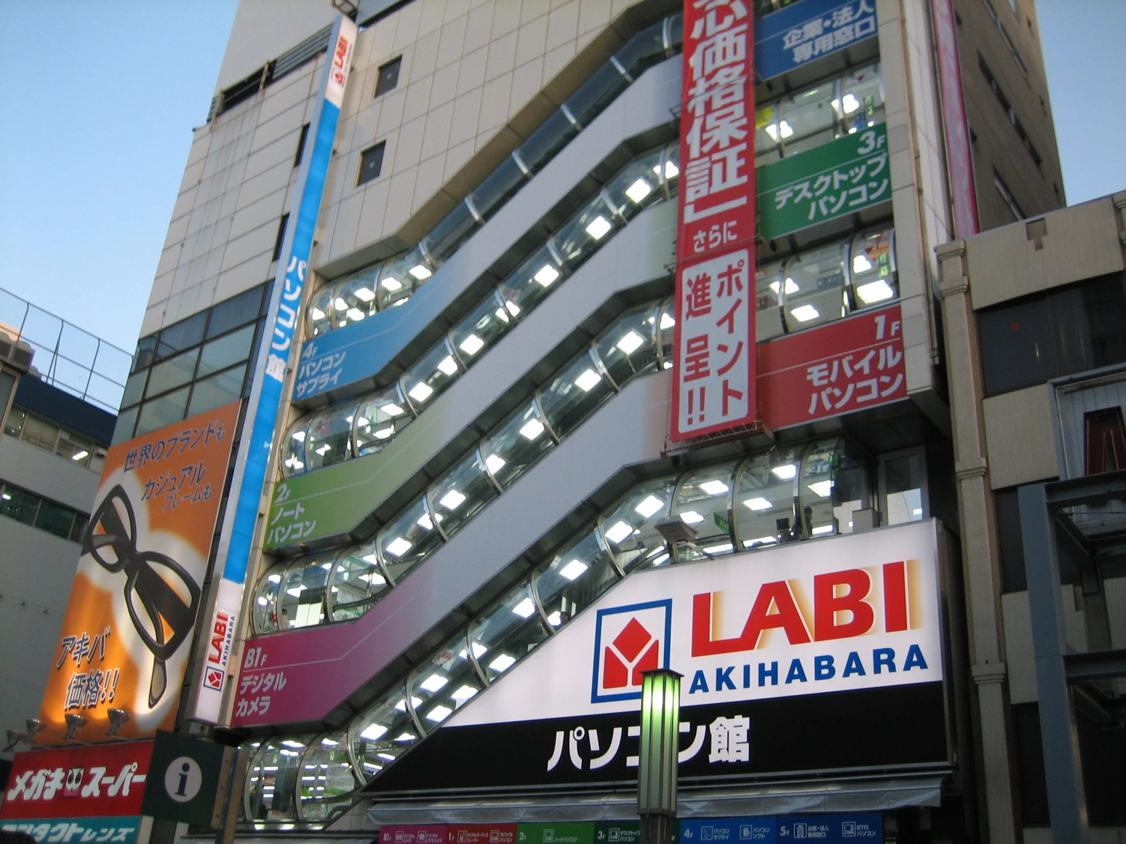 some buildings that have various business signs on them