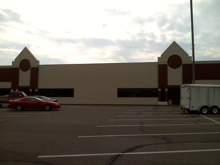 a couple of vehicles that are parked in a lot