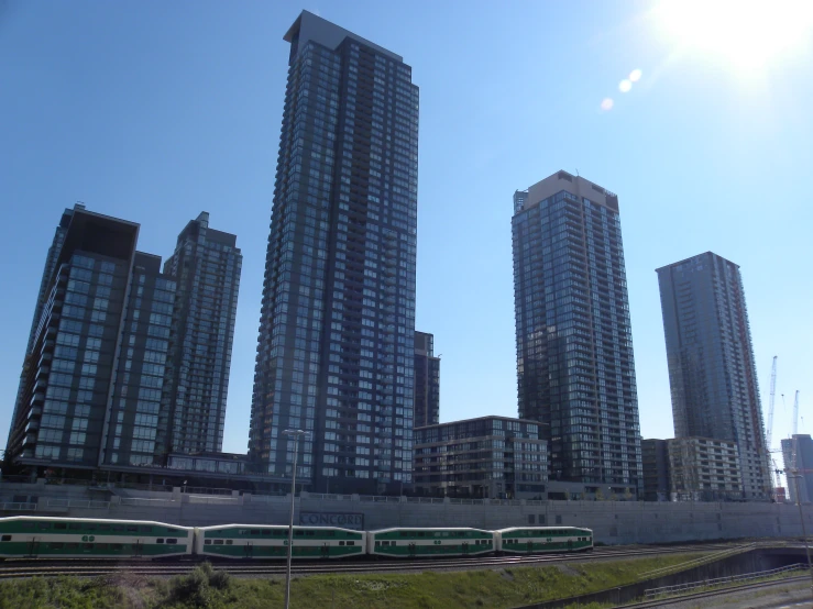 several high rise buildings in a city, including the train