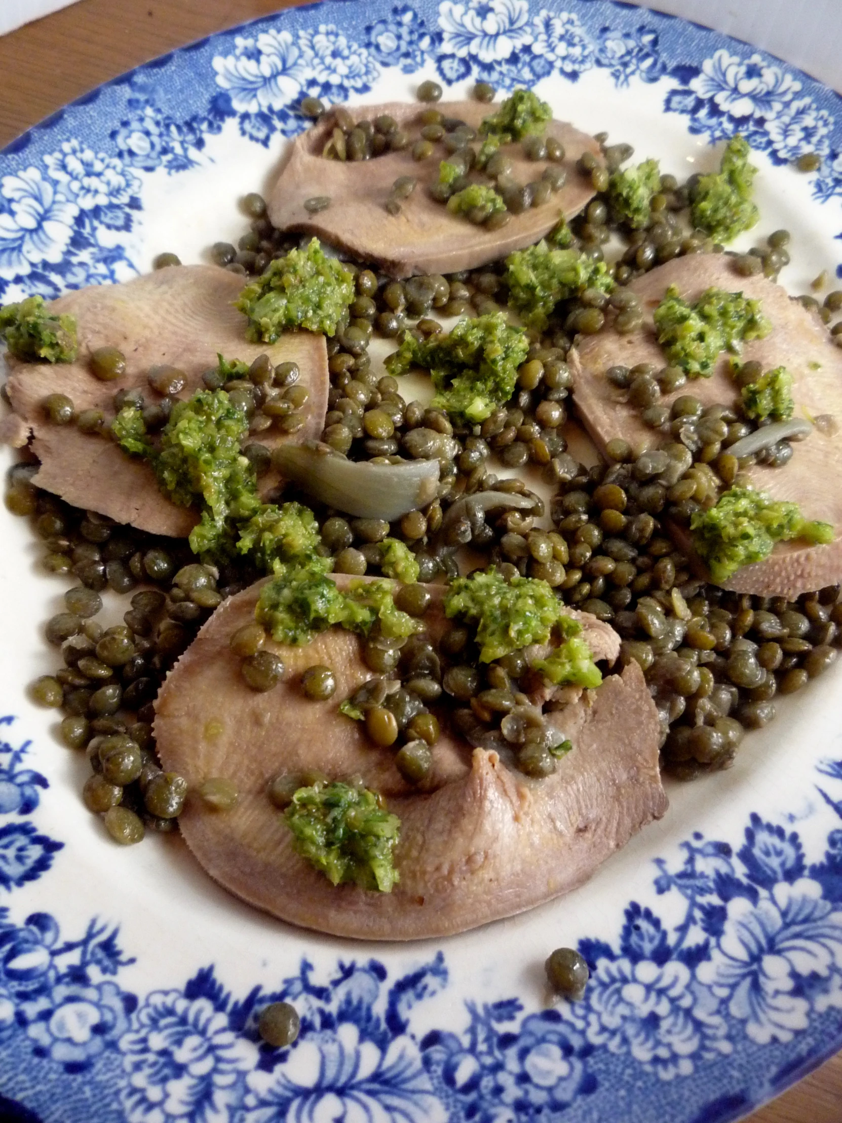 food on a plate with green broccoli and meat