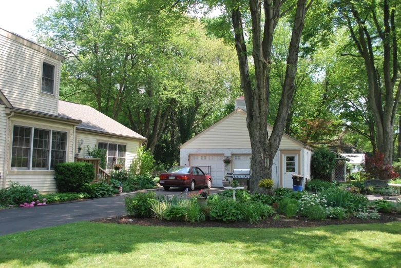 a house and a car are shown in front of a driveway