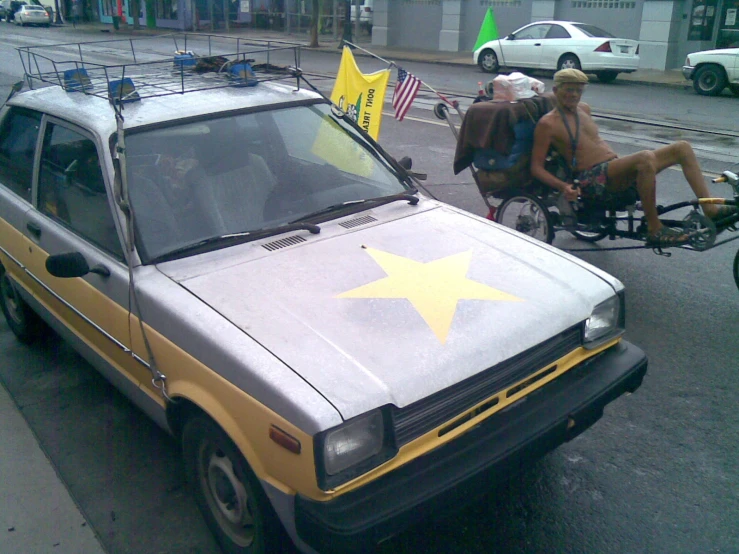 a yellow and white car that has stars on it