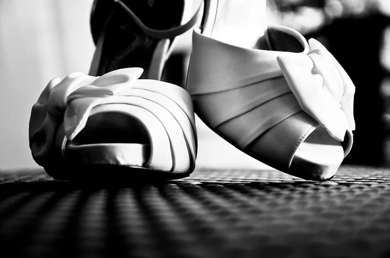 a pair of women's high heels sitting on the ground