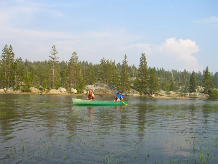 a canoe filled with people near the shore