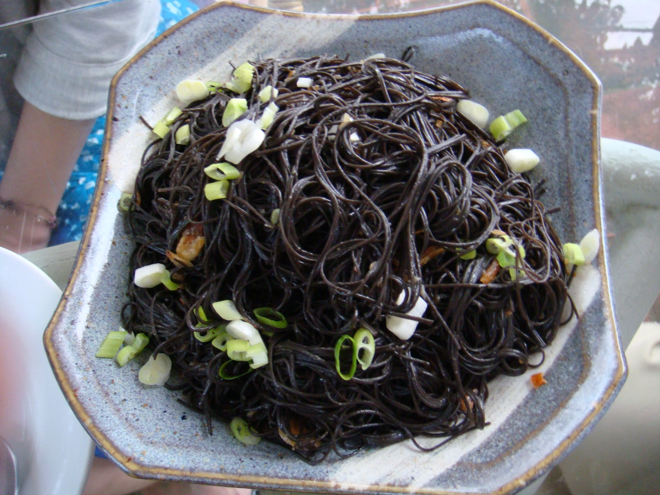 there is a dish with noodles on the plate