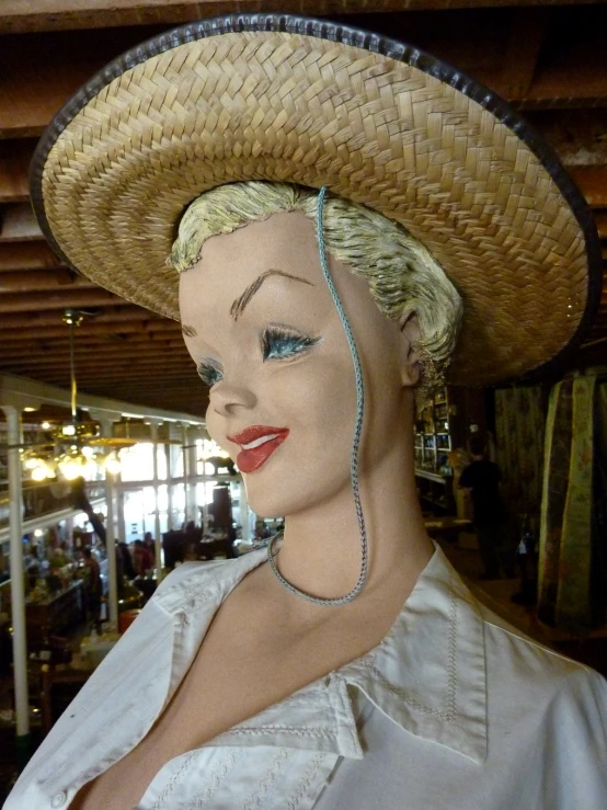 a women's hat and a wig on display in a store