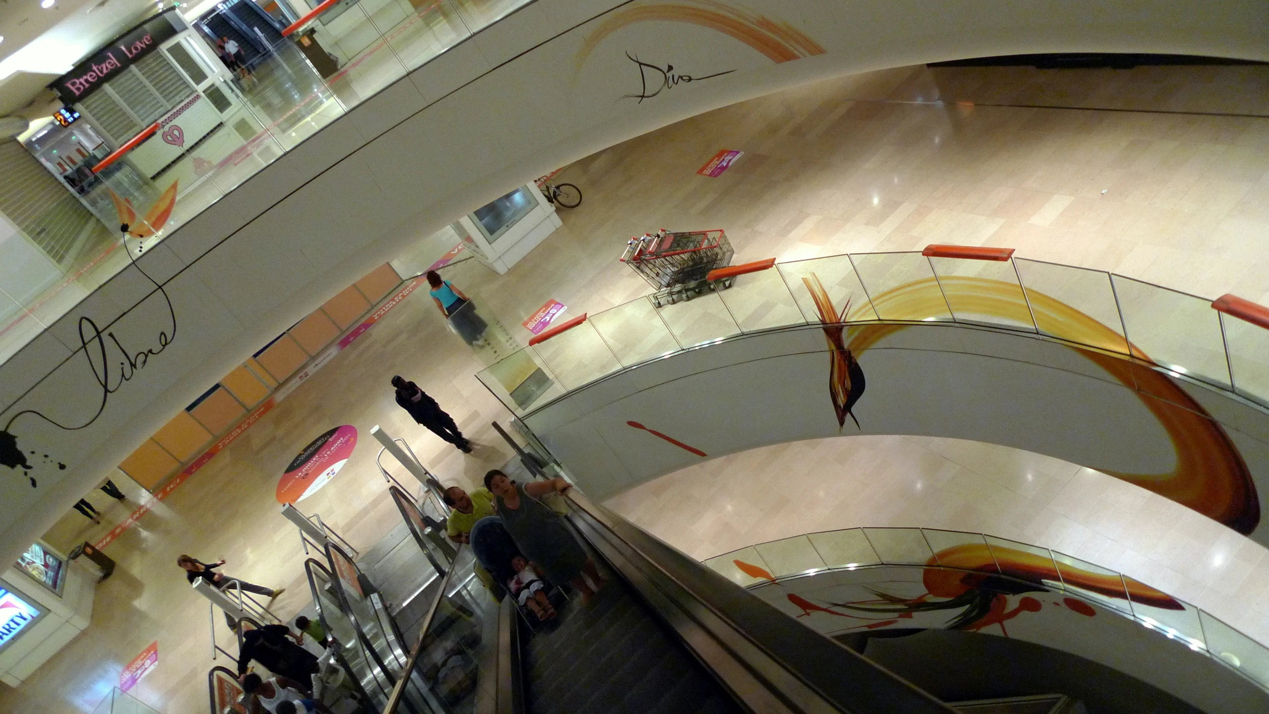 several people on escalator in an underground building