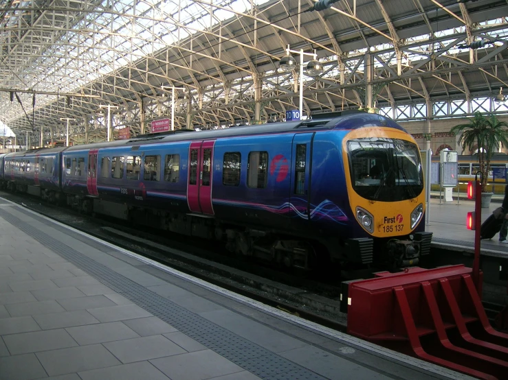 a passenger train pulling into a train station