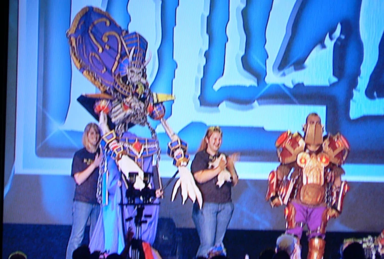 a group of women in costumes on stage